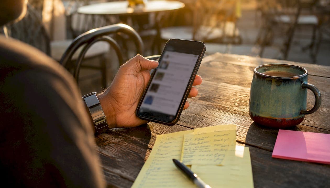 Overhead view of hand scrolling social media hooks